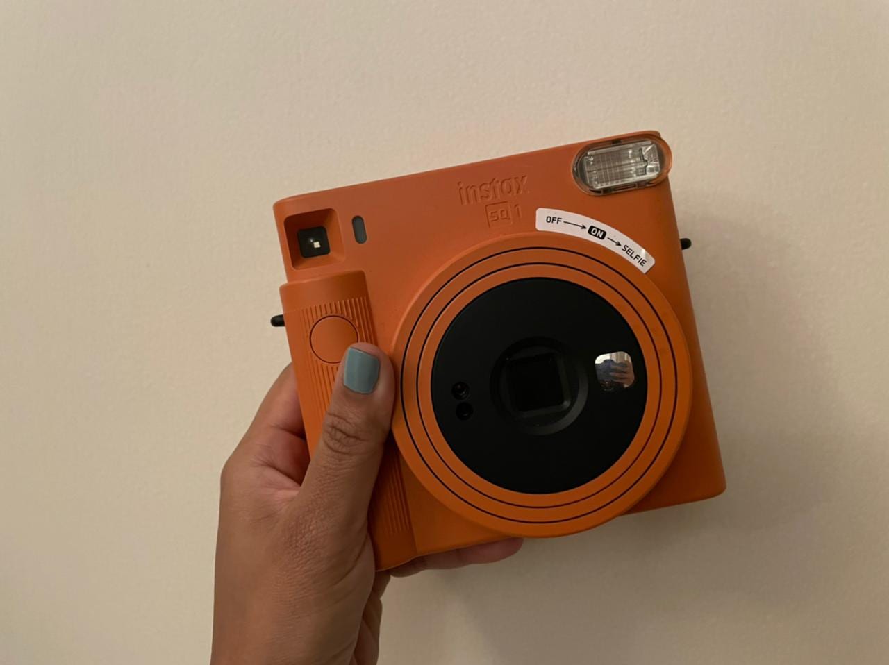 The Fujifilm Instax SQUARE SQ1 is chunky and its colours are a whole shade different from the light pastels we’ve seen on most of the other Instax cameras.
