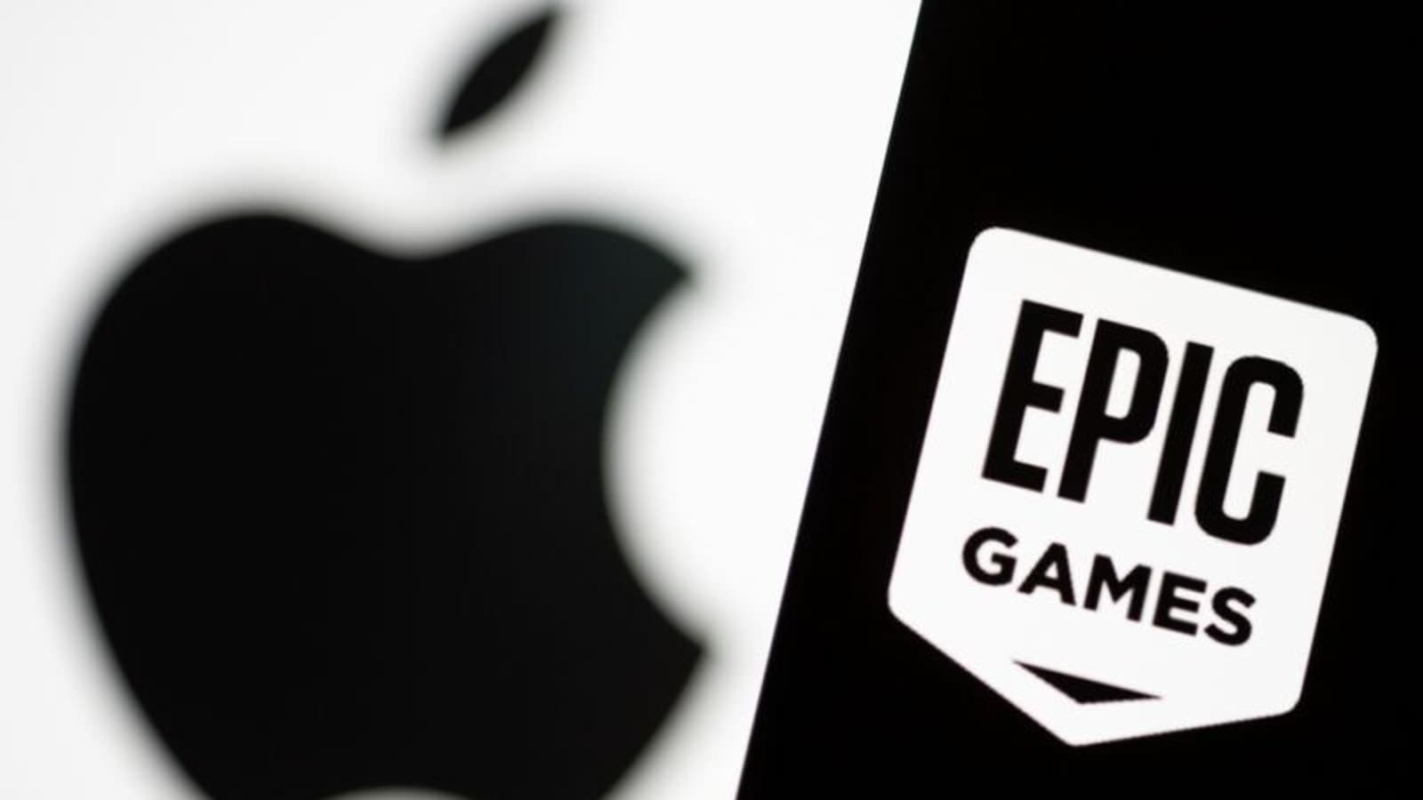 Smartphone with Epic Games logo is seen in front of Apple logo in this illustration taken, May 2, 2021. REUTERS/Dado Ruvic/Illustration