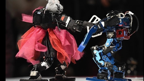 Two humanoid robots spar during the 32nd ROBO-ONE tournament in Tokyo, Japan. The ROBO-ONE is a bi-annual fighting competition for bipedal walking robots, aiming to share advances in robotics and spread the popularity of bipedal walking robots among enthusiasts. (Matt Roberts / Getty Images) Two humanoid robots spar during the 32nd ROBO-ONE tournament in Tokyo, Japan. The ROBO-ONE is a bi-annual fighting competition for bipedal walking robots, aiming to share advances in robotics and spread the popularity of bipedal walking robots among enthusiasts. (Matt Roberts / Getty Images)