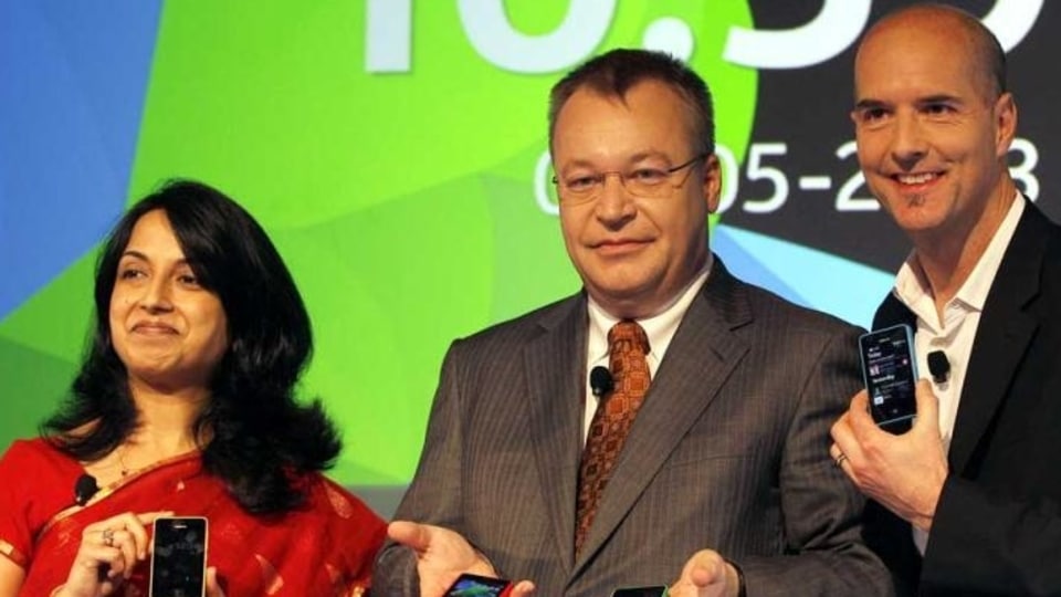 Nokia's chief executive officer Stephen Elop, center, head developer Sangeeta Bavi, left, and design head Peter Skillman display Nokia Asha 501 smartphones during its launch in New Delhi. (AP)