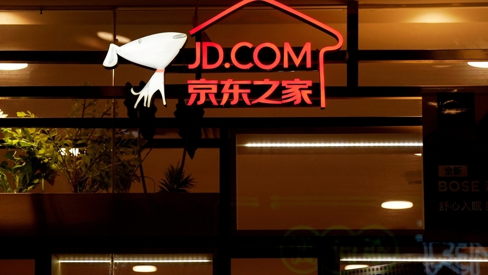 FILE PHOTO: A sign of China's e-commerce company JD.com is seen at its shop at a mall in Shanghai, China October 26, 2018. REUTERS/Aly Song/File Photo