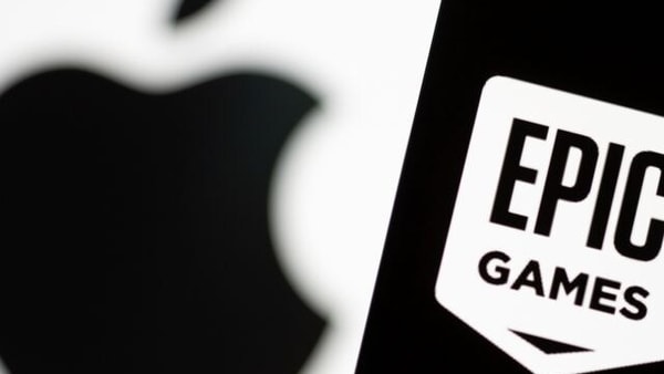 Smartphone with Epic Games logo is seen in front of Apple logo in this illustration taken, May 2, 2021. REUTERS/Dado Ruvic/Illustration