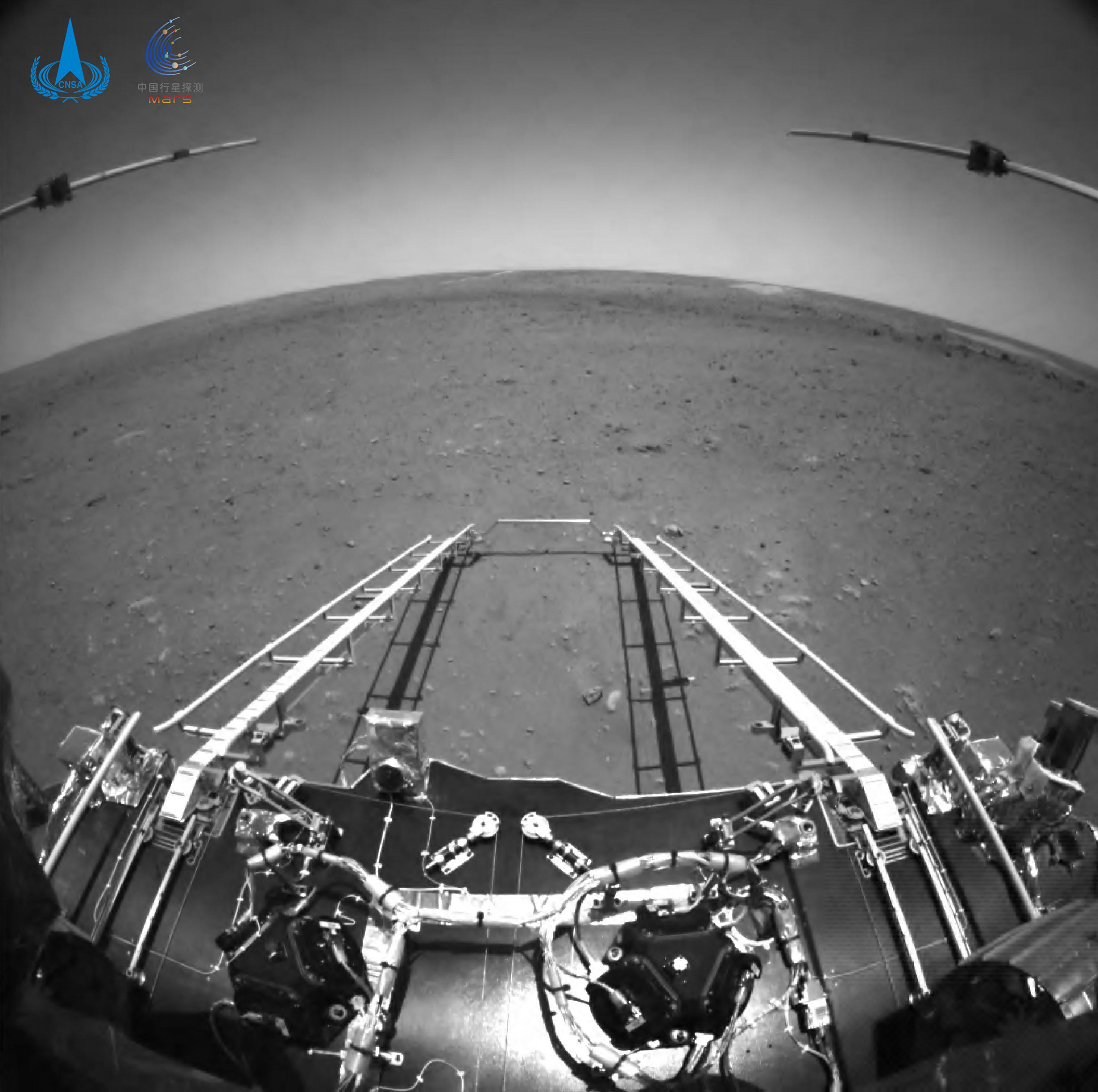 This picture released on May 19, 2021, by the China National Space Administration (CNSA) via CNS shows an image taken by the front obstacle avoidance camera of China's Zhurong rover, facing the rover's direction of movement and showing the deployment of the ramp mechanism, on the surface of Mars, after it landed on Mars on May 15, 2021.