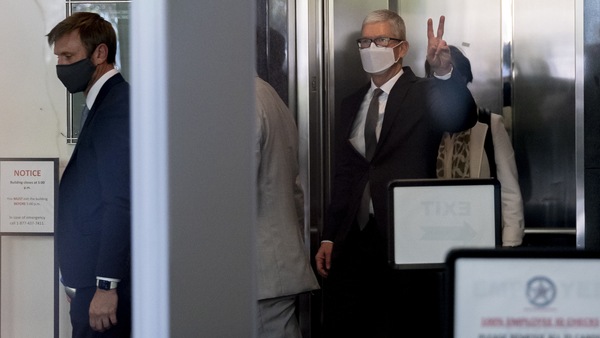 Tim Cook, chief executive officer of Apple Inc., gestures while exiting U.S. district court in Oakland, California, U.S., on Friday, May 21, 2021. About 47,600 games are featured on Apple's App Store under the same 