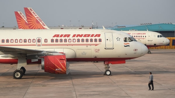 (FILE PHOTO) In this file photo taken on March 2, 2020, an Air India plane is seen parked at the Indira Gandhi International airport in New Delhi. - Hackers have stolen data on about 4.5 million Air India passengers around the world in the latest breach reported by a major airline. 