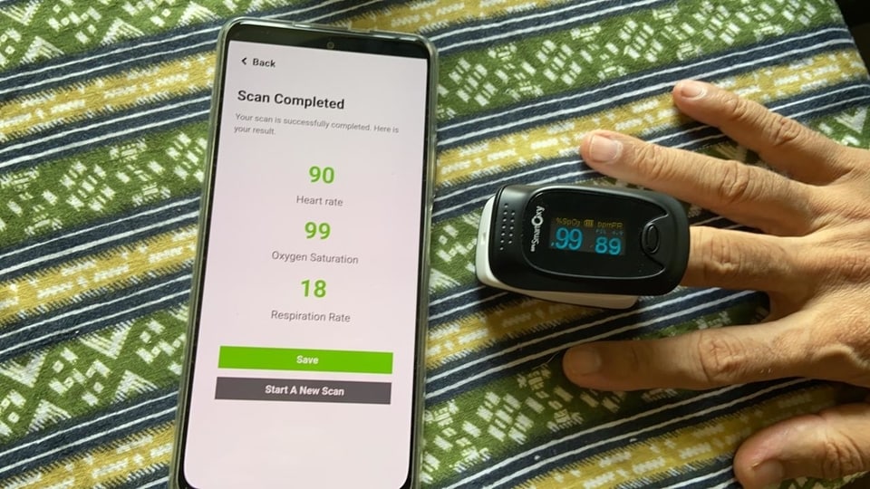 The CarePlix Vitals app on an Android device, with a BPL pulse oximeter for comparison.