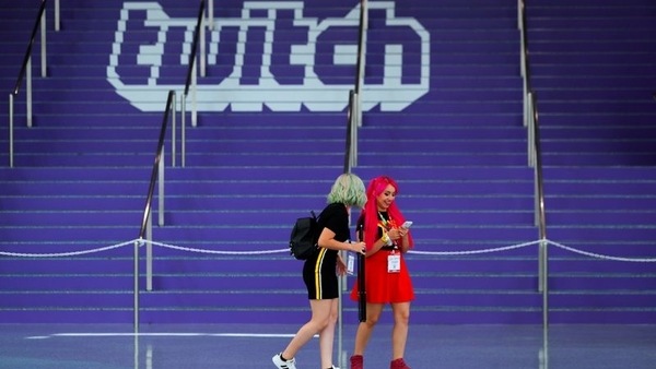 FILE PHOTO: Attendees walk past a Twitch logo painted on stairs during opening day of E3, the annual video games expo revealing the latest in gaming software and hardware in Los Angeles, California, U.S., June 11, 2019.  REUTERS/Mike Blake
