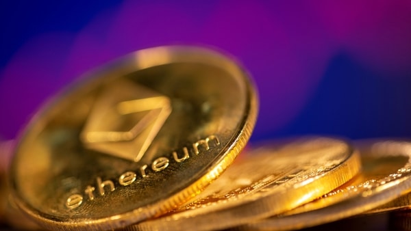 FILE PHOTO: A representation of virtual currency Ethereum are seen in front of a stock graph in this illustration taken February 19, 2021. 