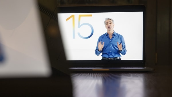 Craig Federighi, senior vice president of software engineering at Apple Inc., speaks virtually during the Apple Worldwide Developers Conference on a laptop computer in Tiskilwa, Illinois, U.S., on Monday, June 7, 2021. Apple is expected to announce its long-rumored 14-inch and 16-inch MacBook Pro with Apple silicon at WWDC, according to Wedbush analyst Daniel Ives. Photographer: Daniel Acker/Bloomberg