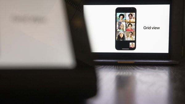 A grid view feature on the FaceTime video chat program on a smartphone presented during the virtual Apple Worldwide Developers Conference on a laptop computer in Tiskilwa, Illinois, U.S., on Monday, June 7, 2021. Apple is expected to announce its long-rumored 14-inch and 16-inch MacBook Pro with Apple silicon at WWDC, according to Wedbush analyst Daniel Ives. Photographer: Daniel Acker/Bloomberg