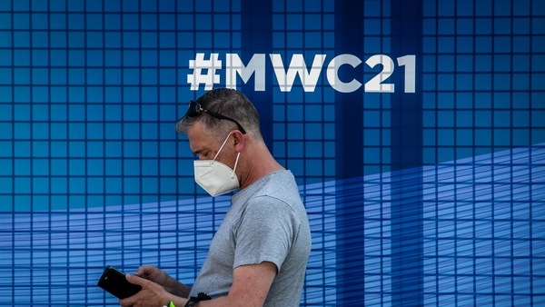 A visitor wears a protective face mask by the Fira de Barcelona venue ahead of the MWC Barcelona in Barcelona, Spain, on Sunday, June 27, 2021. 