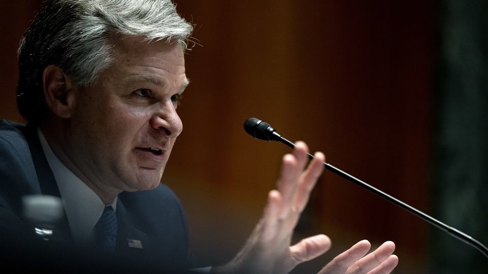 File Photo: Christopher Wray, director of the Federal Bureau of Investigation (FBI), speaks during a Senate Appropriations Committee hearing in Washington, D.C., U.S., on Wednesday, June 23, 2021.