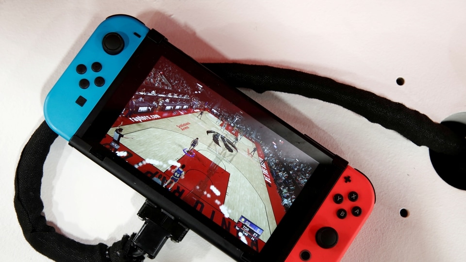 FILE PHOTO: A Nintendo Switch game console is pictured at the Paris Games Week in Paris, France, October 29, 2019. REUTERS/Benoit Tessier/File Photo