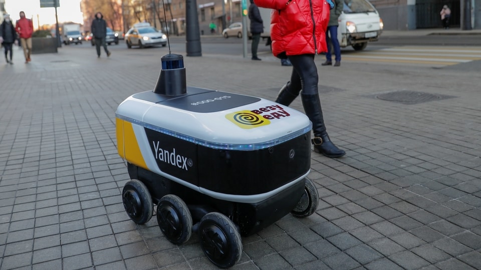 Yandex Rover, a driverless robot for delivering hot restaurant meals, is seen at a business district in Moscow. 