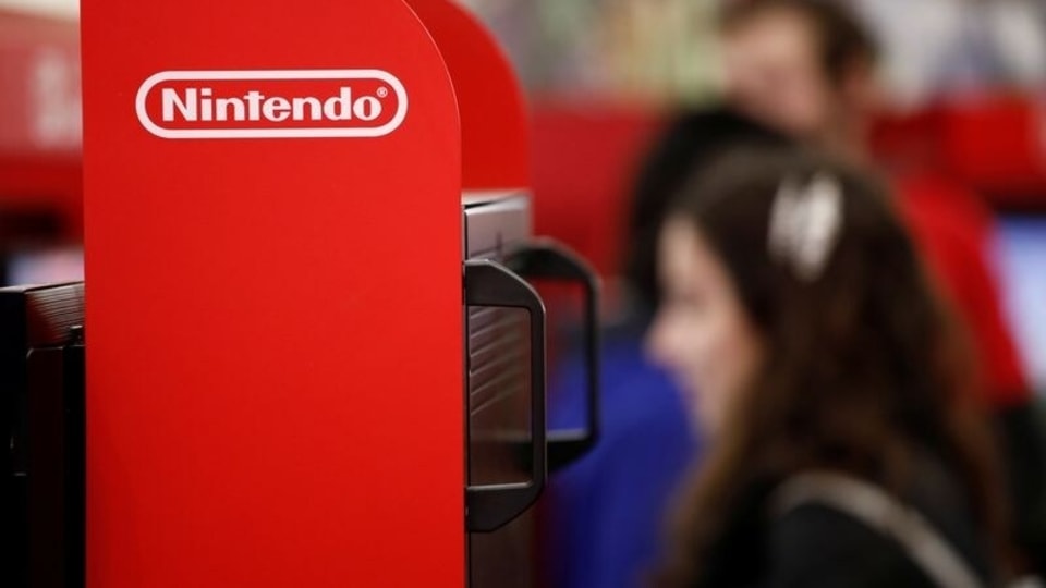 An attendee uses a Nintendo Switch game console while playing a video game at the Paris Games Week (PGW), a trade fair for video games in Paris, France, October 29, 2019. REUTERS/Benoit Tessier/Files