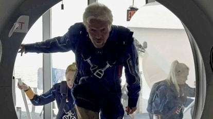 Richard Branson and Virgin Galactic crew members enter the company's passenger rocket plane, the VSS Unity, in a still image from undated handout video taken at Spaceport America near Truth or Consequences, New Mexico, US Virgin Galactic/Handout via REUTERS.