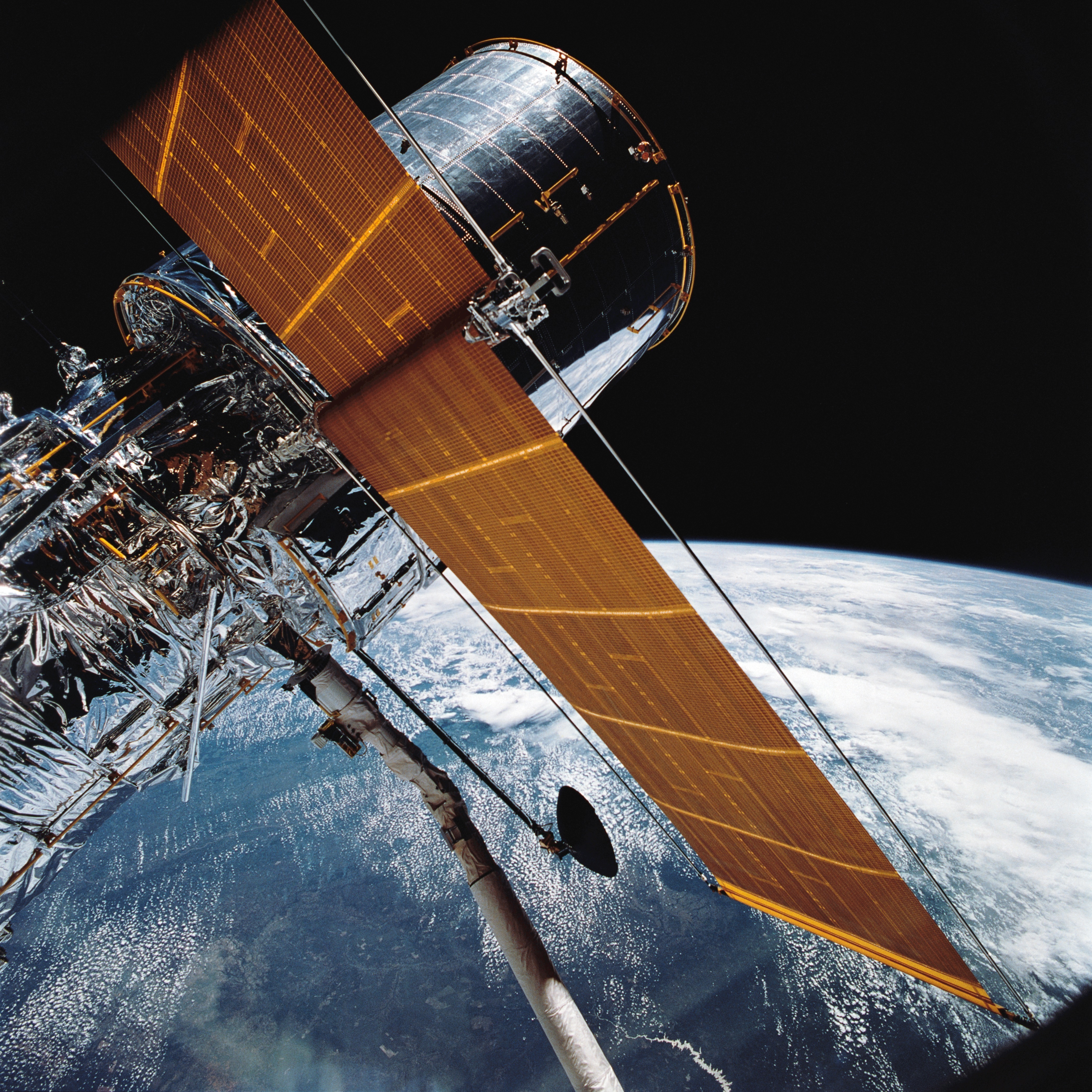 Throughout five spacewalks from December 4-8, the astronauts performed intricate repairs and upgrades. In the initial spacewalk, Story Musgrave and Jeff Hoffman replaced Hubble's gyroscopes and electrical control units. The second spacewalk, led by Tom Akers and Kathy Thornton, involved replacing the telescope's solar arrays with more temperature-resistant versions. Musgrave and Hoffman returned for the third spacewalk, replacing Hubble's primary camera with an advanced version featuring corrective mirrors to rectify the telescope's initial blurry vision. Hubble Space Telescope