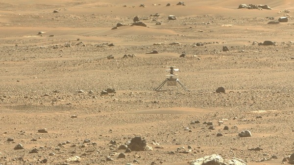 This NASA photo obtained June 30, 2021, 2021 shows NASA's Ingenuity Mars Helicopter(C) viewed using an image taken June 6, 2021 (the 105 the Martian day, or sol, of the mission), by the right Mastcam-Z cameras aboard NASA's Perseverance Mars rover.