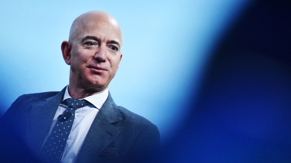 (FILES) In this file photo taken on October 22, 2019 Blue Origin founder Jeff Bezos speaks after receiving the 2019 International Astronautical Federation (IAF) Excellence in Industry Award during the the 70th International Astronautical Congress at the Walter E. Washington Convention Center in Washington, DC. - Blue Origin owner Jeff Bezos wrote an open letter to NASA on July 26, 2021, offering a $2 billion discount to allow his company to build a Moon lander. (Photo by MANDEL NGAN / AFP) (FILES) In this file photo taken on October 22, 2019 Blue Origin founder Jeff Bezos speaks after receiving the 2019 International Astronautical Federation (IAF) Excellence in Industry Award during the the 70th International Astronautical Congress at the Walter E. Washington Convention Center in Washington, DC. - Blue Origin owner Jeff Bezos wrote an open letter to NASA on July 26, 2021, offering a $2 billion discount to allow his company to build a Moon lander. (Photo by MANDEL NGAN / AFP)