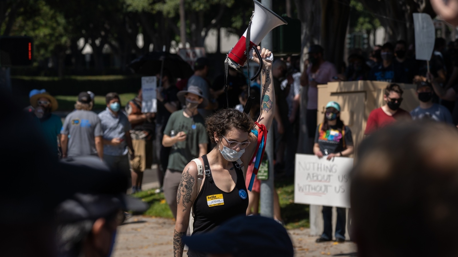 A protester raises a megaphone on Blizzard Way during a walkout at Activision Blizzard offices in Irvine, California, U.S., on Wednesday, July 28, 2021. Activision Blizzard Inc. employees called for the walkout on Wednesday to protest the company's responses to a recent sexual discrimination lawsuit and demanding more equitable treatment for underrepresented staff. Photographer: Bing Guan/Bloomberg