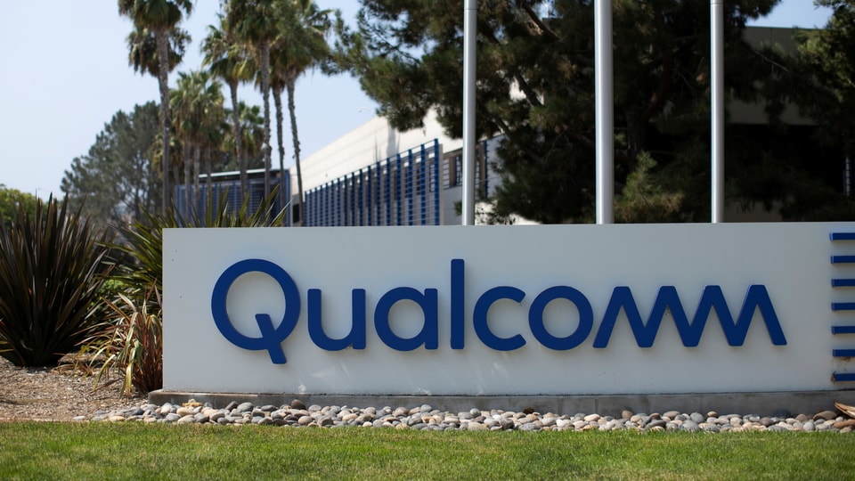 FILE PHOTO: A Qualcomm sign is shown outside one of the company's many buildings in San Diego, California, U.S., September 17, 2020. REUTERS/Mike Blake/File Photo