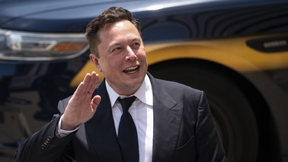 Elon Musk, chief executive officer of Tesla Inc., waves while departing court during the SolarCity trial in Wilmington, Delaware, U.S., on Tuesday, July 13, 2021. Photographer: Al Drago/Bloomberg