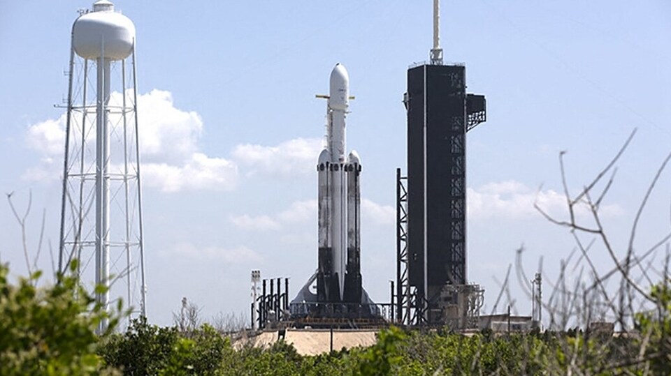 This SpaceX photo released by NASA on June 24, 2019 shows SpaceX Falcon Heavy rocket ready for launch on the pad at Launch Complex 39A at NASA's Kennedy Space Center in Florida. NASA said it had selected SpaceX to launch a planned voyage to Jupiter's icy moon Europa, a huge win for Elon Musk's company as it sets its sights deeper into the solar system. 
