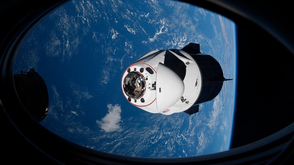 FILE PHOTO: In this Saturday, April 24, 2021 photo made available by NASA, the SpaceX Crew Dragon capsule approaches the International Space Station for docking. 