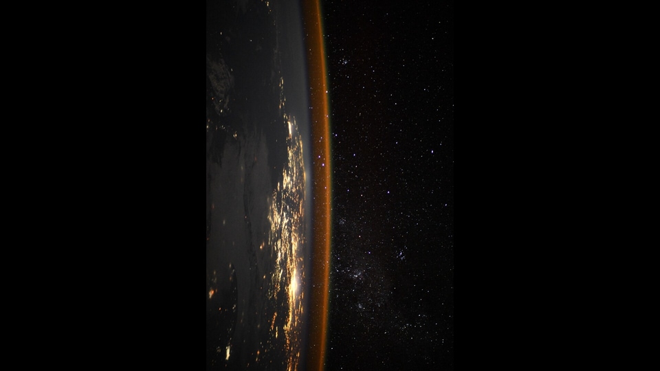 Taken from the cupola of the ISS, Pesquet’s photo shows city lights battling it out with the light from the distant stars