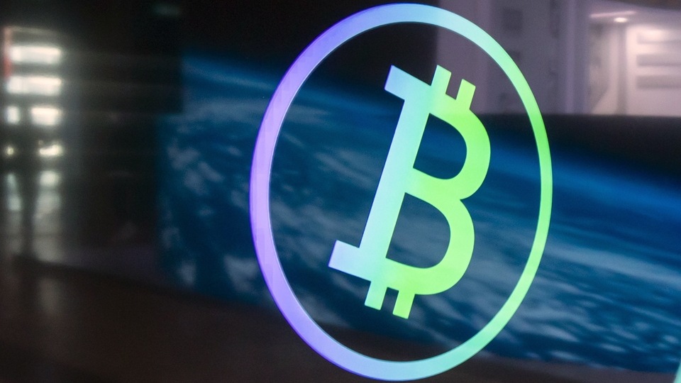 Signage for Bitcoin at a booth at the Hong Kong Fintech Week in Hong Kong, China, on Thursday, Nov. 4, 2021. bitcoin