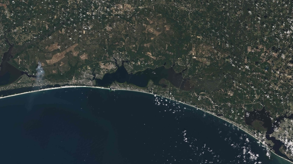This image collected by Landsat and released by NASA, shows the white sands of Pensacola Beach stand out of the Florida Panhandle of the US.