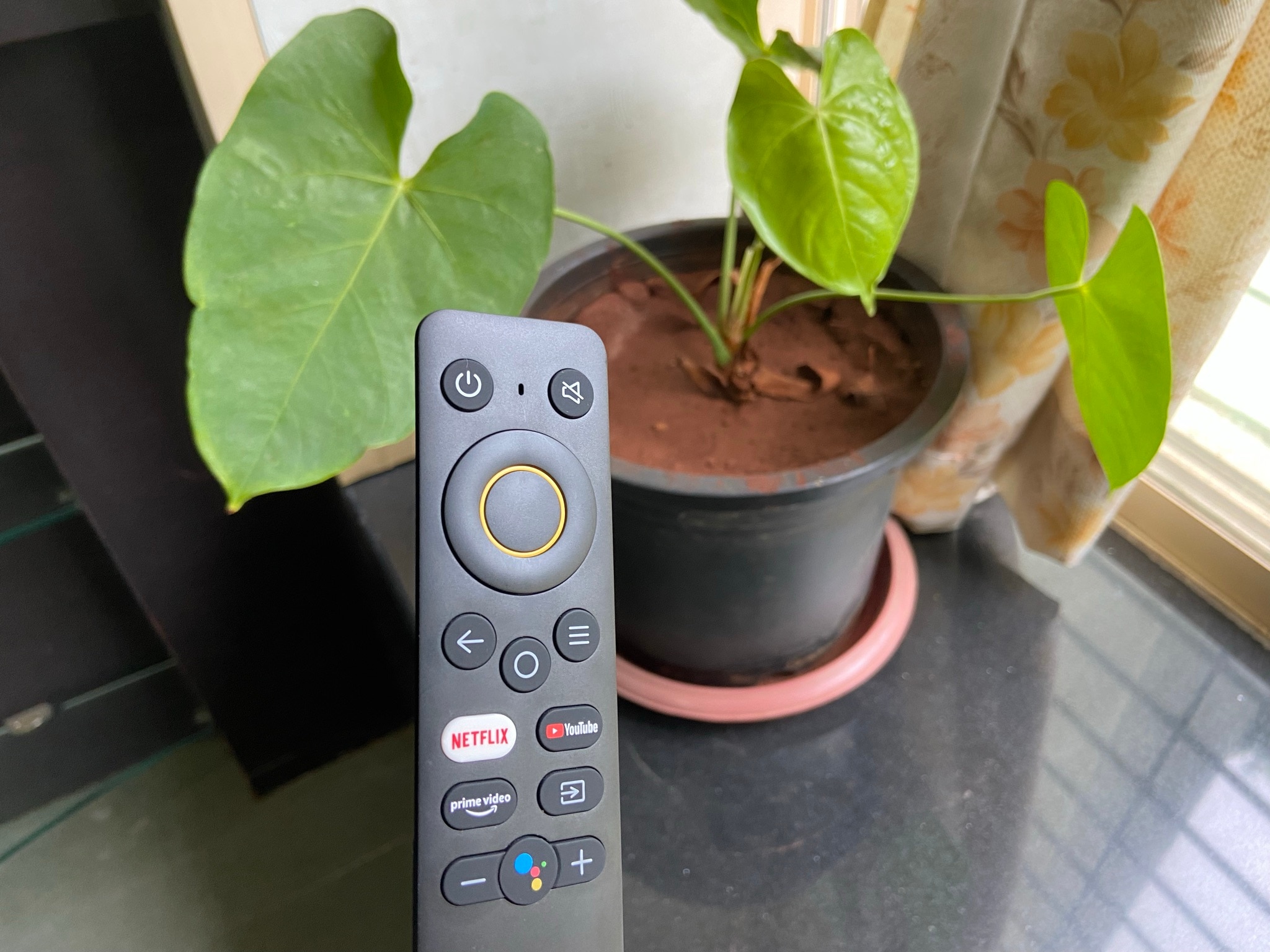 Realme Smart TV 4K Review: The included remote is powered by two AAA batteries and comes with dedicated YouTube, Assistant, Netflix and Amazon Prime buttons.