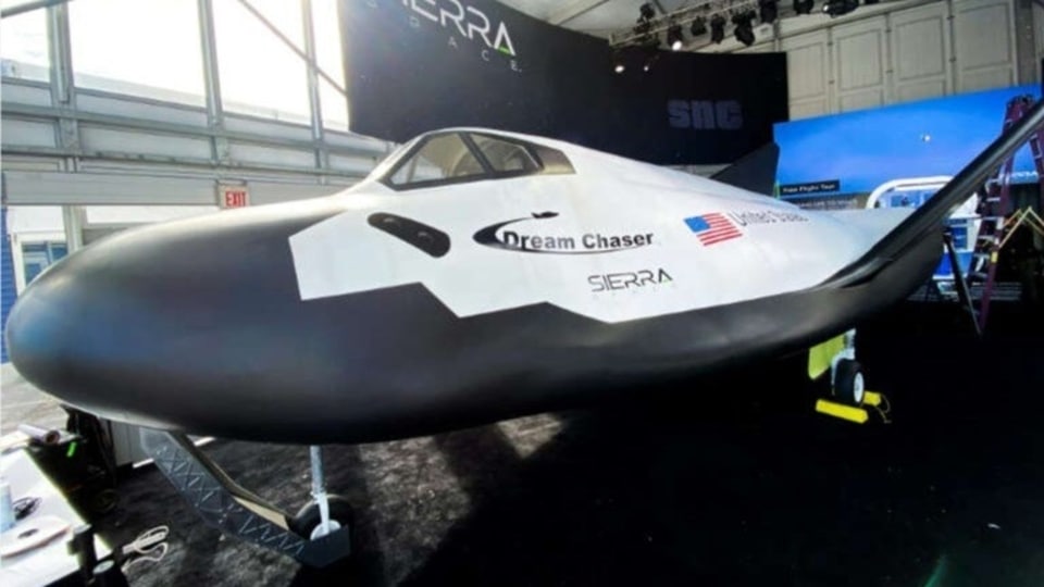 A full sized crew model of the Sierra Space Dream Chaser space plane is displayed at CES. 
