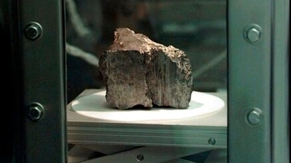 The meteorite labeled ALH84001 sits in a chamber at a Johnson Space Center lab in Houston. Scientists say they've confirmed the meteorite from Mars contains no evidence of ancient Martian life. 