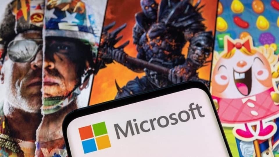 The Microsoft logo is seen in front of characters from Activision Blizzard games.