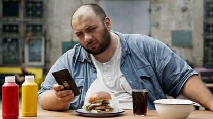 Man using phone at table