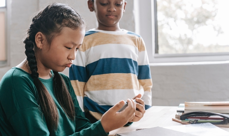 Kids playing mobile games