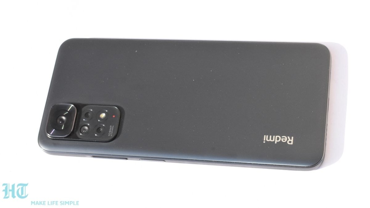 Redmi Note 11S Design: It comes with a minimalistic design at the back featuring a camera mount at the extreme left. The back panel is made of plastic which gets smudged easily with fingerprints. It is available in three colour options - Graphite Gray (in pics), Twilight Blue, and Pearl White. Redmi Note 11S