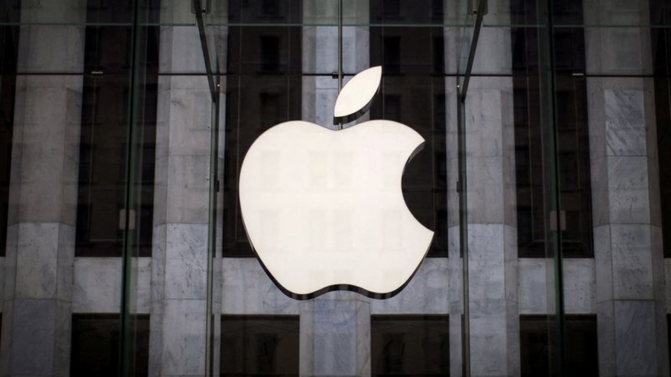 FILE PHOTO: An Apple logo hangs above the entrance to the Apple store on 5th Avenue in the Manhattan borough of New York City, July 21, 2015. REUTERS/Mike Segar//File Photo