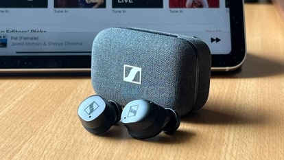 The Sennheiser Momentum True Wireless 3 retains its signature fabric-covered case design in a new shade of black. The earbuds are sleeker now and get touch-based controls. The eartips are made of silicon and the ear-fins help to keep the buds in place. The case now also supports wireless charging. 