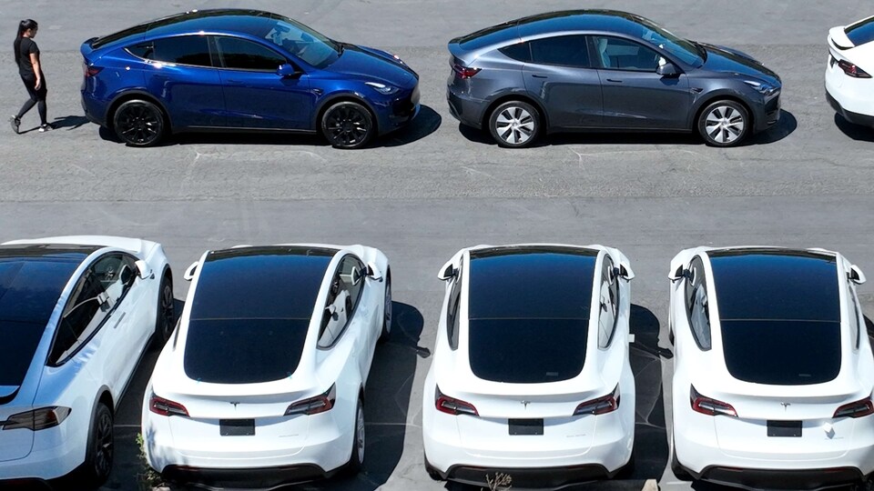 Brand new Tesla cars sit in a parking lot at a Tesla showroom on June 27, 2022 in Corte Madera, California.