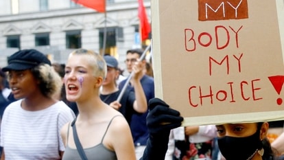 A protester displays a poster during a demonstration against the U.S. Supreme Court's decision about abortion.