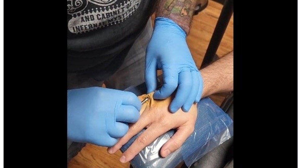 Tesla owner get a Vivokey Apex chip in his right hand to unlock his car. 