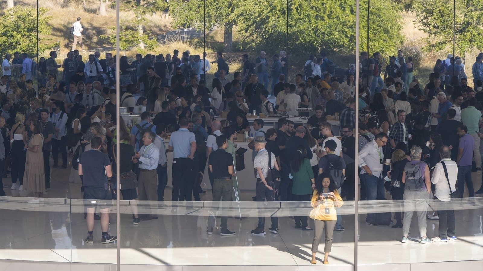Attendees arrive at the Steve Jobs Theater ahead of an event at Apple Park campus in Cupertino, California, US, on Wednesday, Sept. 7, 2022. Apple is set to unveil the iPhone 14 line. iPhone 14 line launch