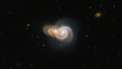 NASA's Hubble Space Telescope captures image showing two overlapping galaxies.