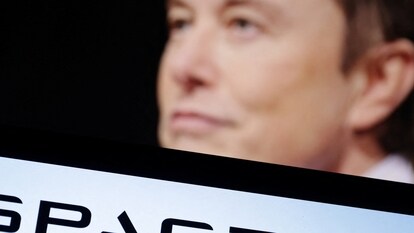 SpaceX logo and Elon Musk photo are seen in this illustration taken, December 19, 2022. REUTERS/Dado Ruvic/Illustration