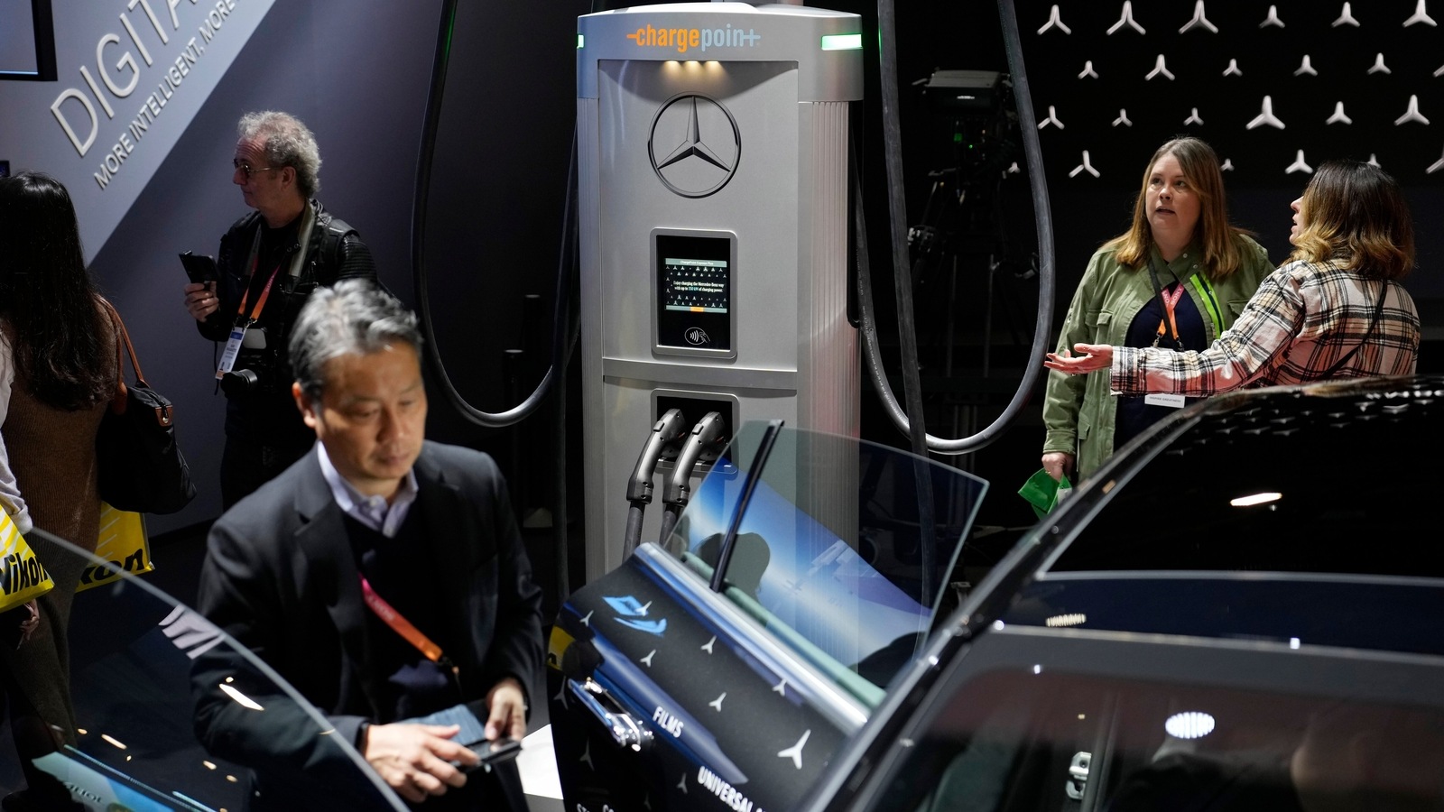A ChargePoint electric vehicle charging hub, center, is on display at the Mercedes-Benz booth during the CES tech show. Mercedes