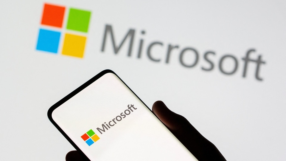 FILE PHOTO: Smartphone is seen in front of Microsoft logo displayed in this illustration taken, July 26, 2021. REUTERS/Dado Ruvic/Illustration/File Photo