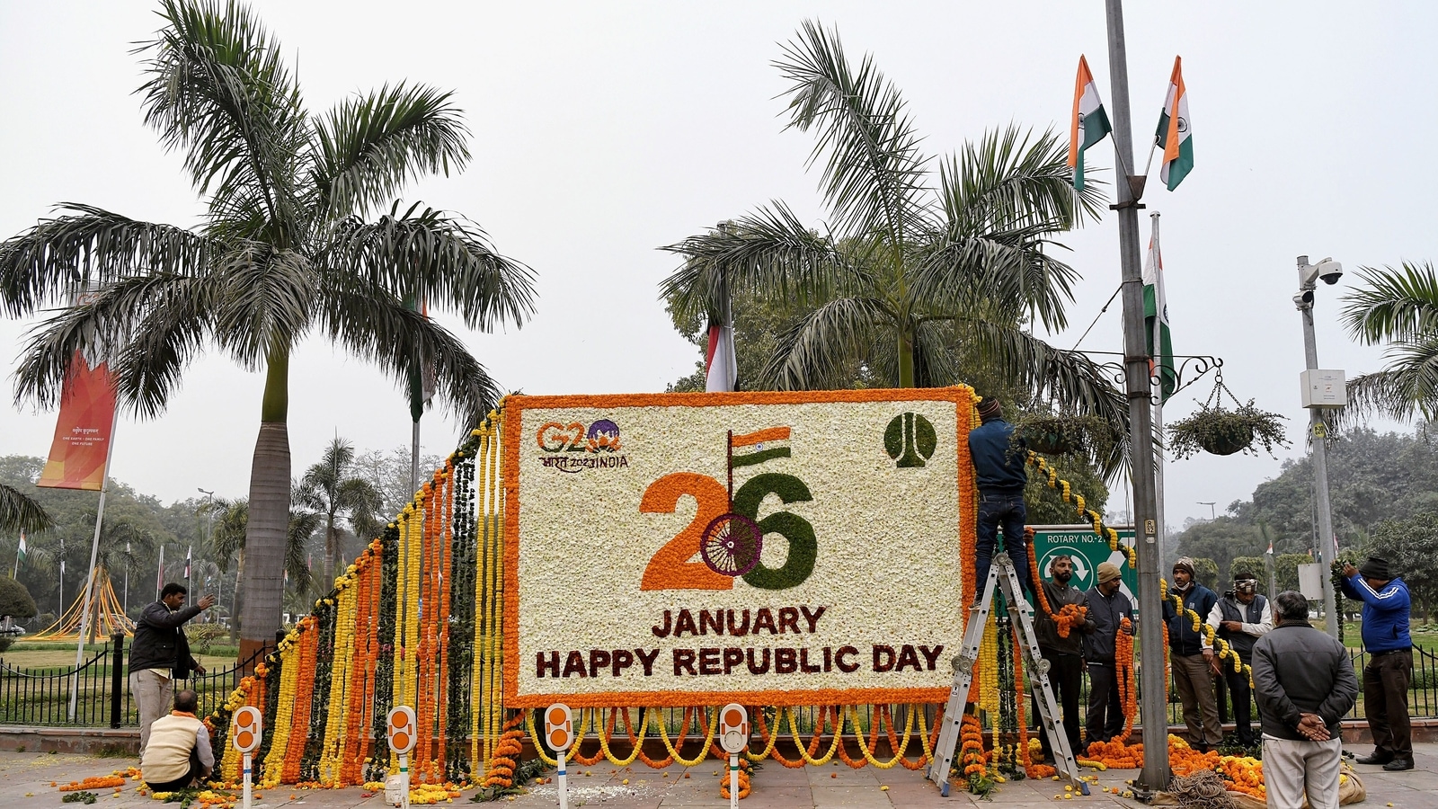 Central Public Works Department (CPWD) workers decorate the hoarding on the eve of Republic Day, in New Delhi on Wednesday. (ANI Photo) Central Public Works Department (CPWD) workers decorate the hoarding on the eve of Republic Day, in New Delhi on Wednesday. (ANI Photo)