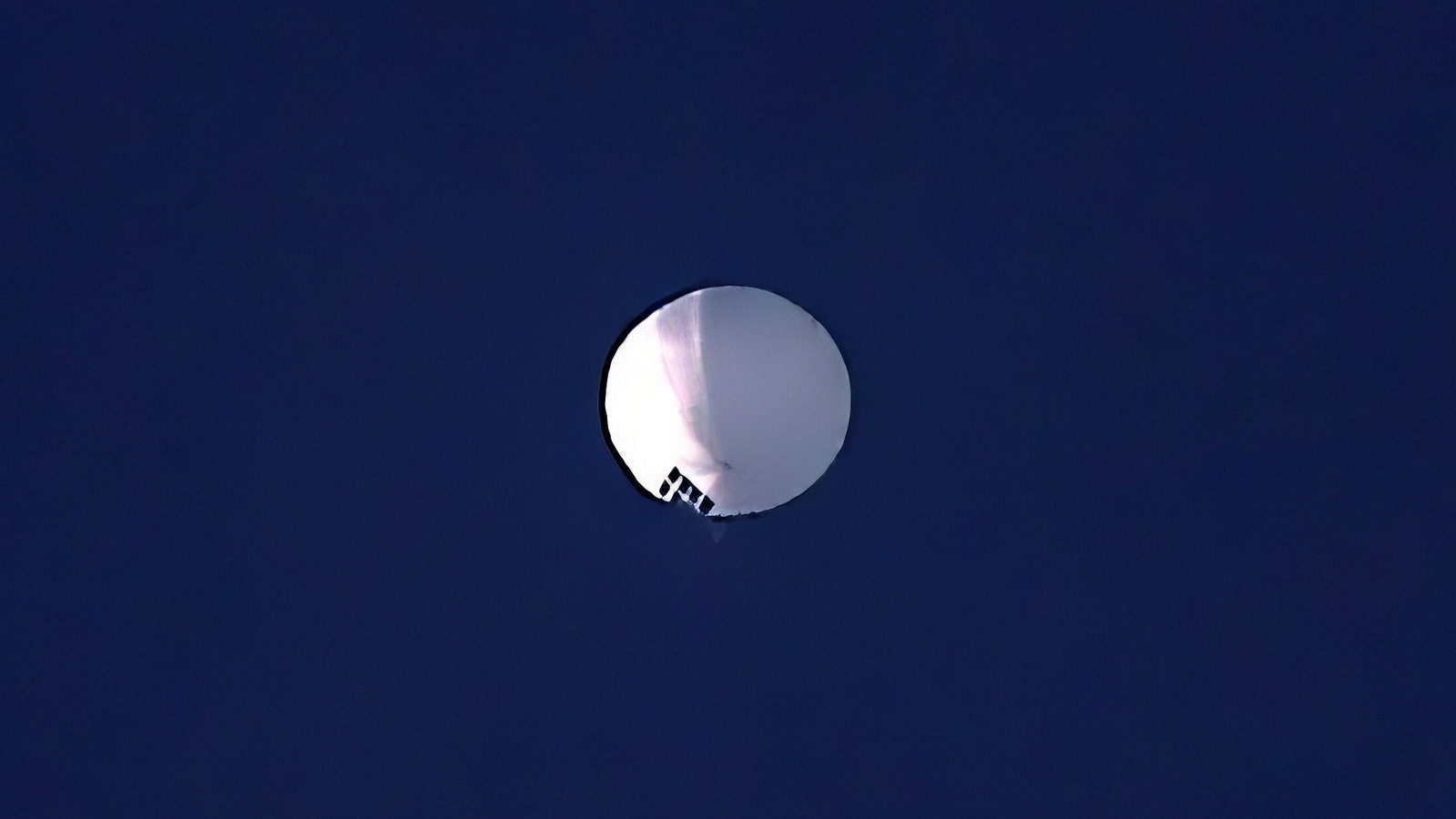A high altitude balloon floats over Billings, Mont., on Wednesday, Feb. 1, 2023. The U.S. is tracking a suspected Chinese surveillance balloon that has been spotted over U.S. airspace for a couple days. Surveillance balloon